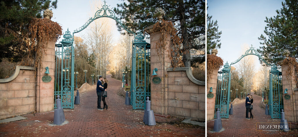 Newly engaged couple stand under teal La Caille gates