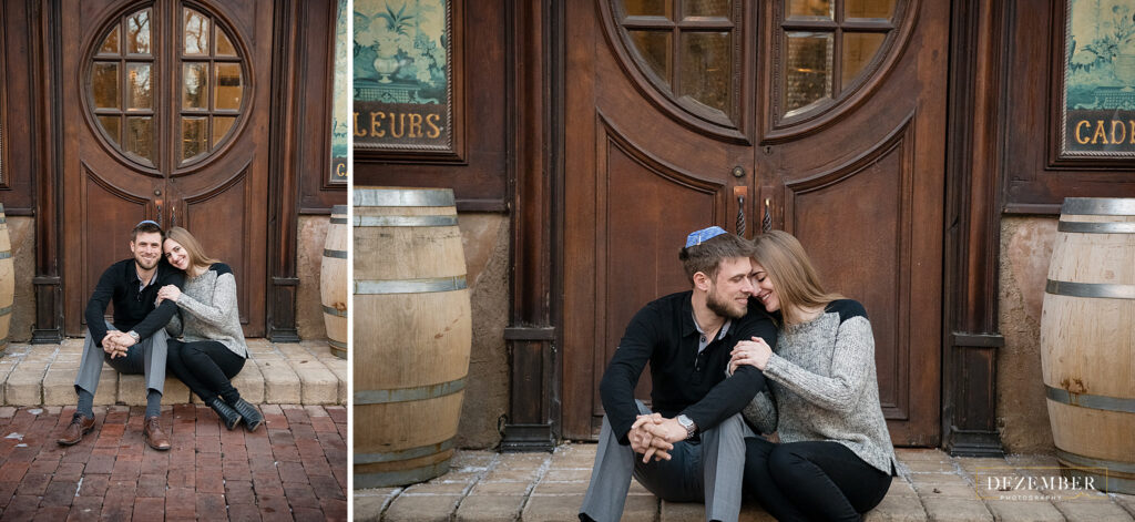 Couple sits in front of big La Caille Doors