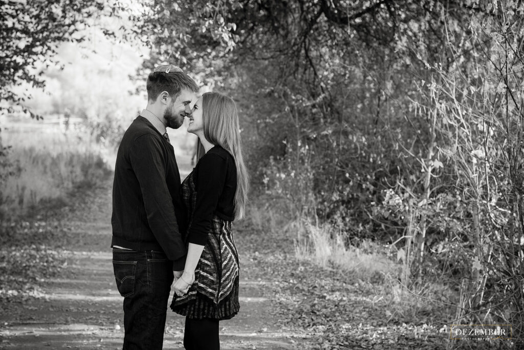 Engaged couple in the park black and white