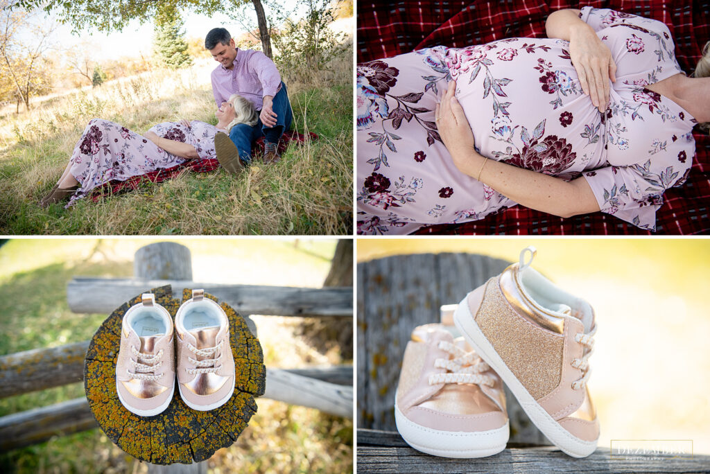 Couple lays in the park with a pair of baby shoes