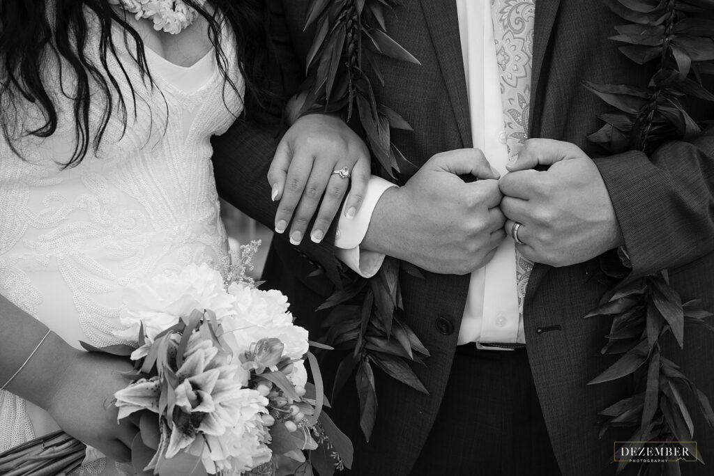 Black and white bride and groom detail shot of hands
