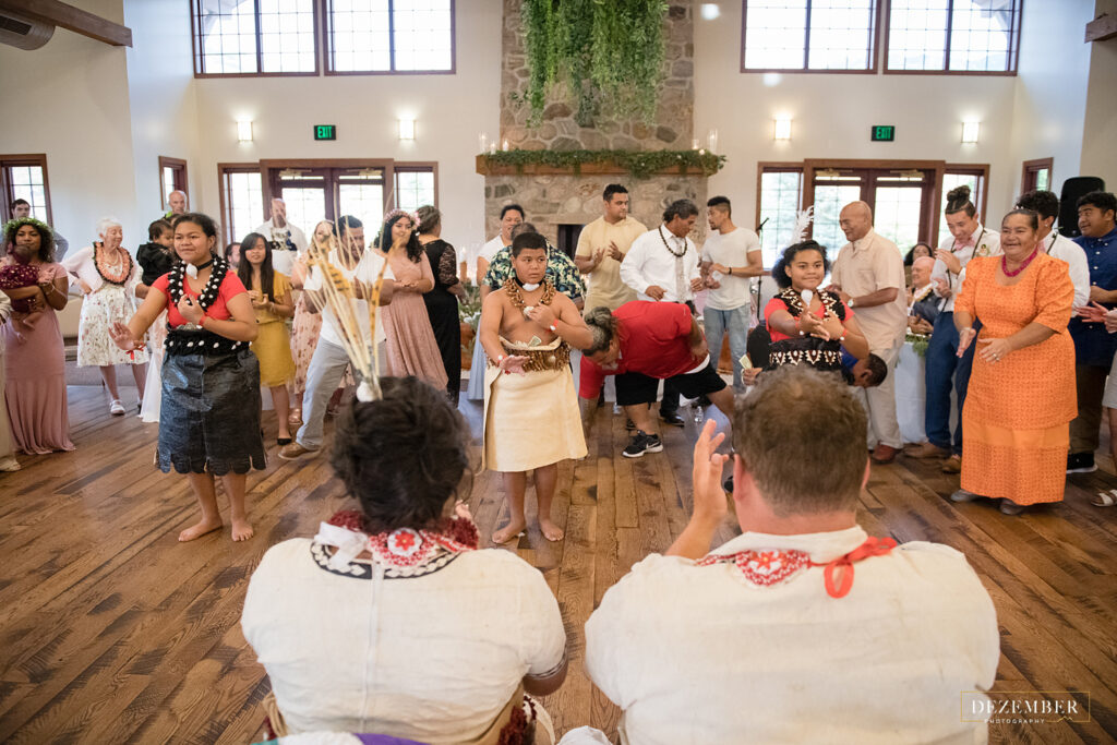 Newlyweds watch the Polynesian money dance
