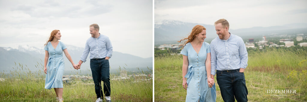 Couple walks in field overlooking Salt Lake