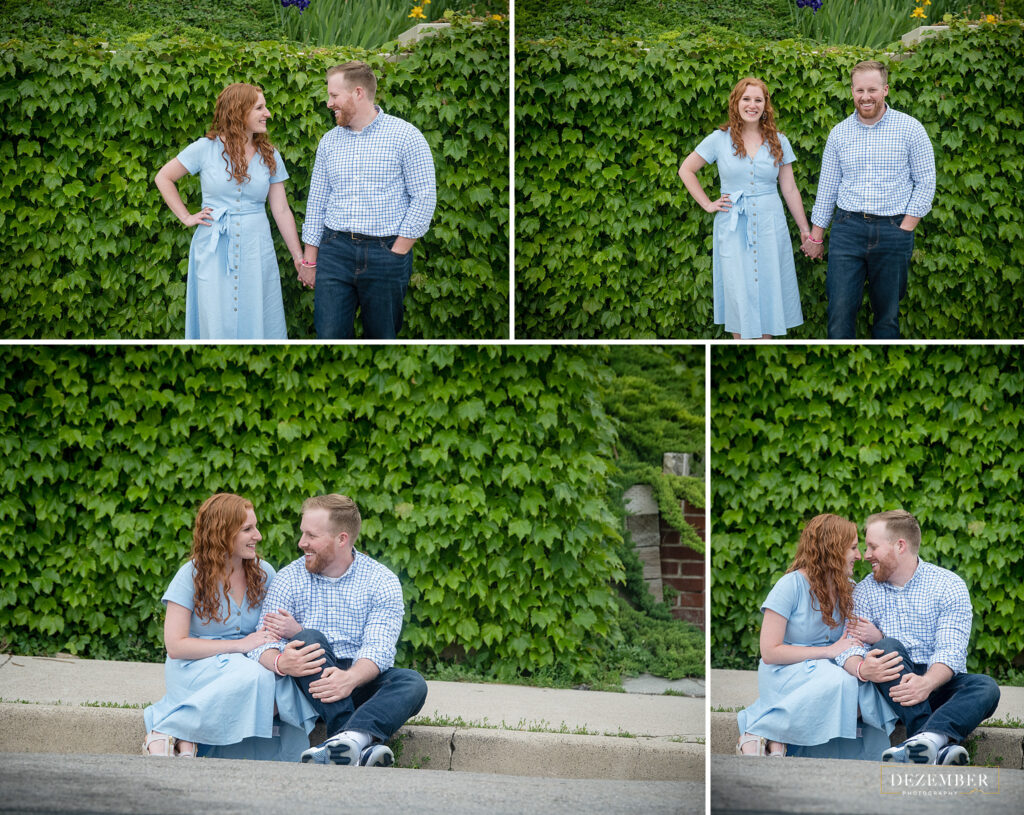 Engaged couple in front of ivy