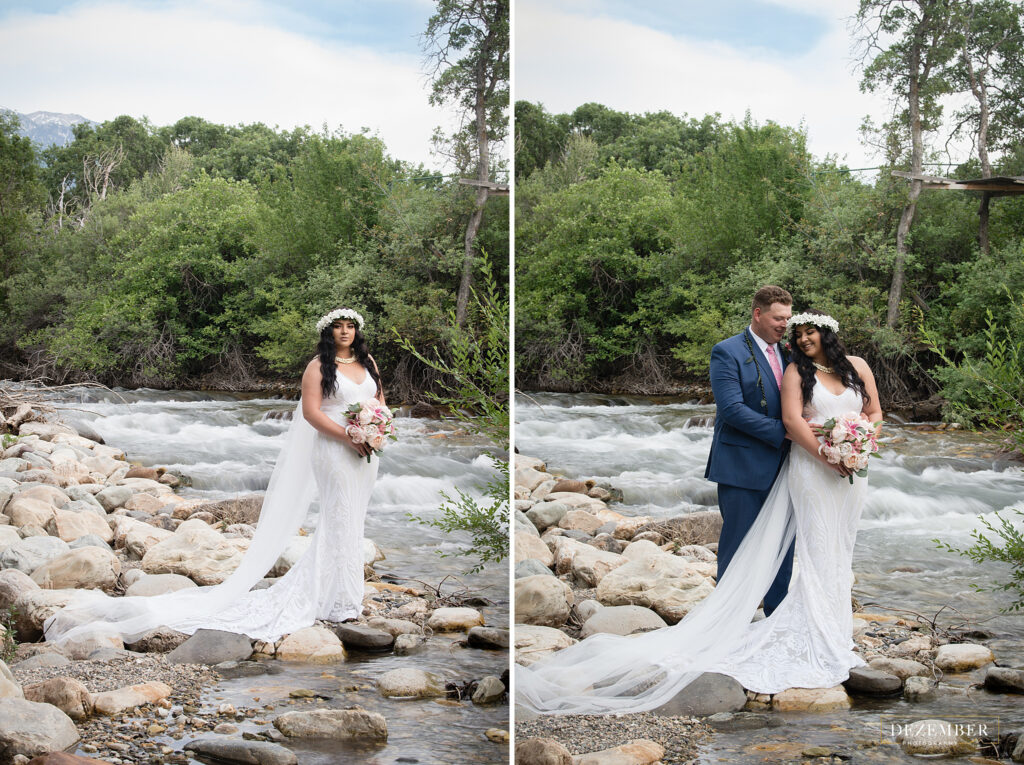 Bride and groom pose near river