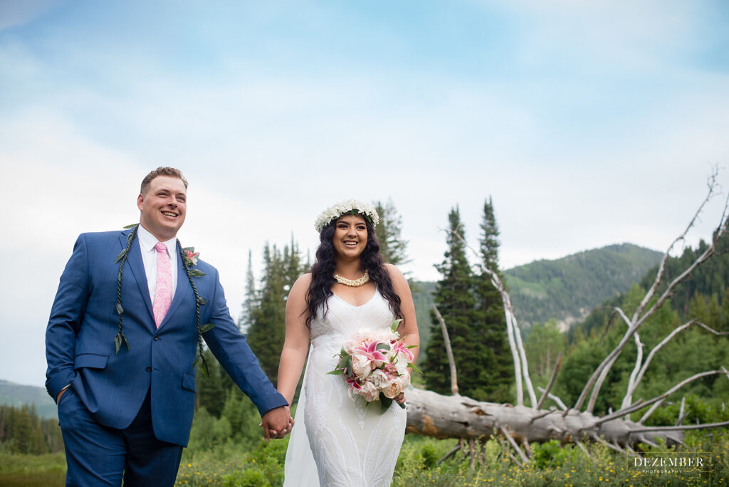 Couple walks through field