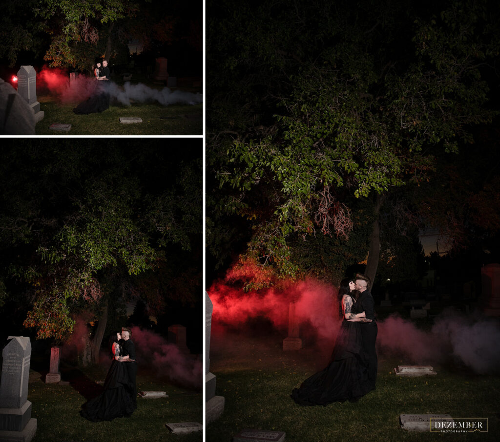 Goth couple kiss in cemetery with smoke bomb