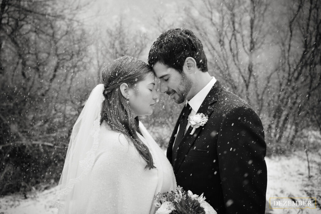Bride and groom intimate snowing wedding