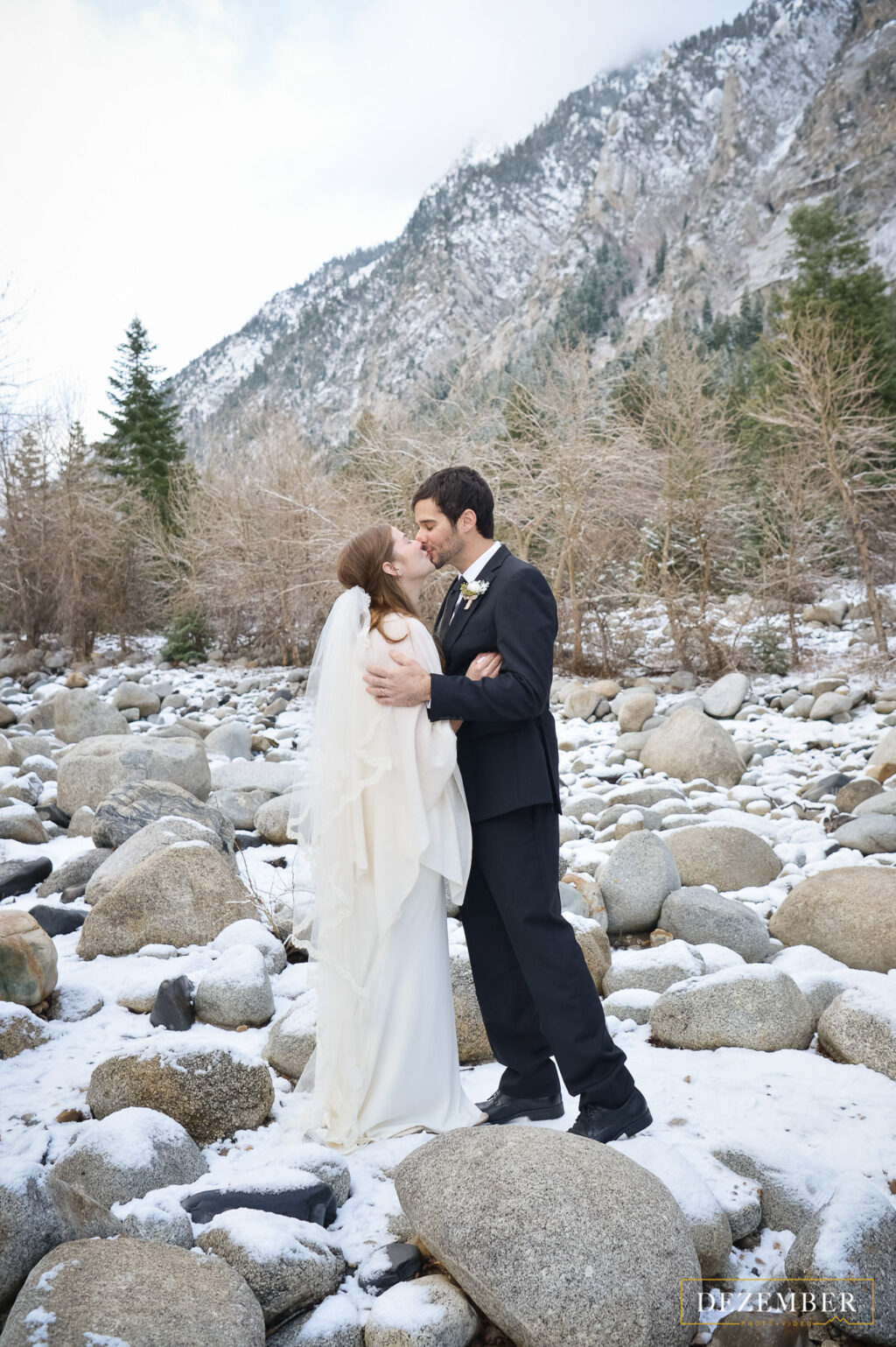 Intimate mountain wedding kiss
