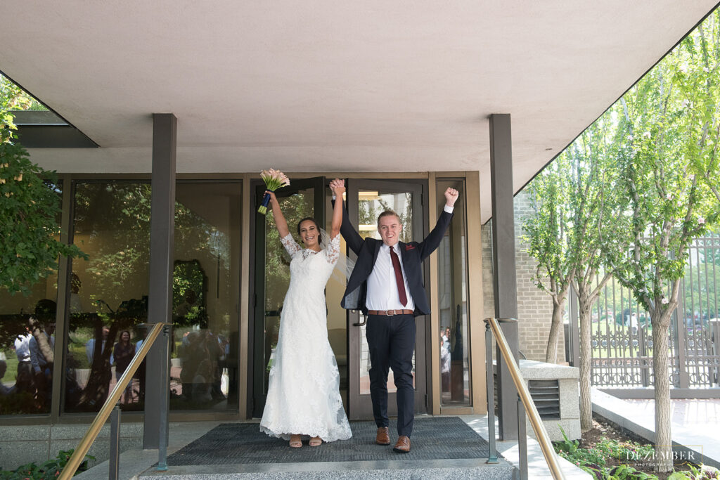 Newly sealed couple walk out of the Salt Lake Temple