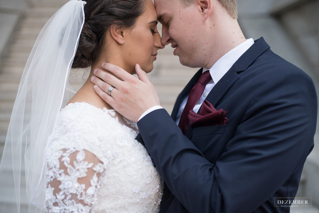 Groom touches bride's face